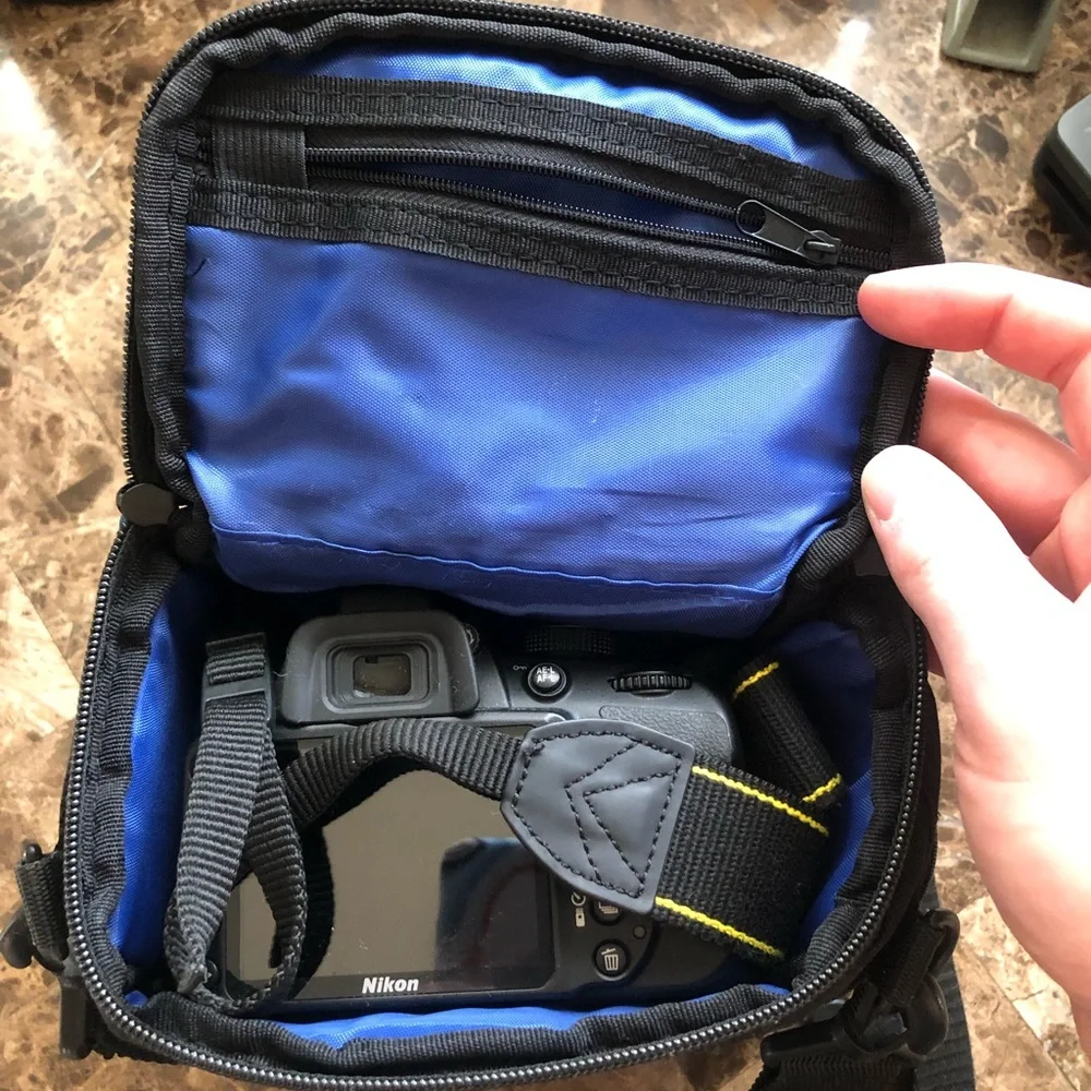 Nikon D3200, charger and case. Great digital camera for a present.